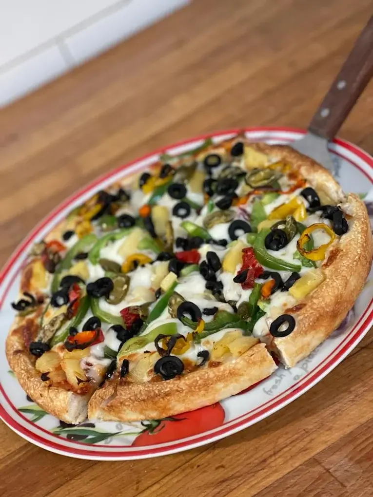 DJ's Special pizza loaded with peppers, jalapenos, pineapple and black olives - DJ's Pizzeria & Lounge, St. Albert, AB